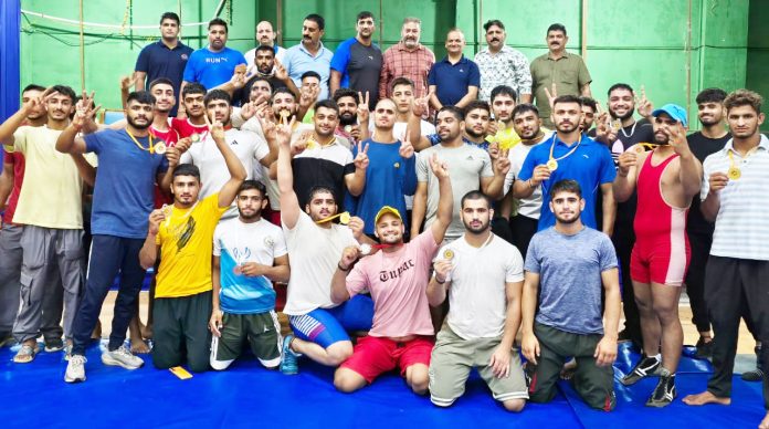 Wrestlers posing along with medals during concluding event at Jammu University on Sunday. Wrestlers posing along with medals during concluding event at Jammu University on Sunday.