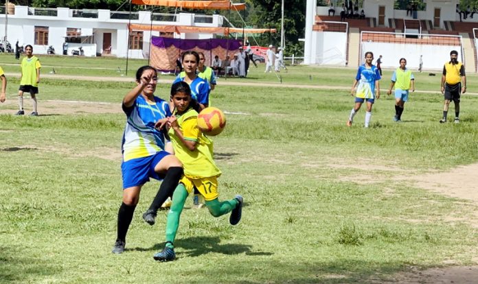 Girls in action during football match at Poonch.