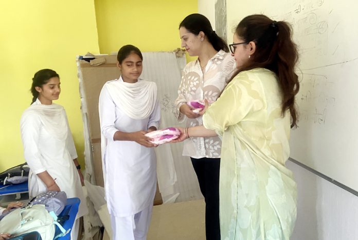 IRCS, J&K team distributing sanitary napkins to girl students of a school in Jammu on Tuesday. IRCS, J&K team distributing sanitary napkins to girl students of a school in Jammu on Tuesday.
