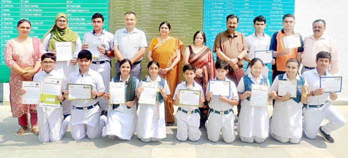 Students of DPS posing along with certificates and teaching staff. Students of DPS posing along with certificates and teaching staff.