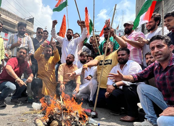 BJYM activists burning the effigy of Dr Farooq Abdullah in Jammu on Tuesday. BJYM activists burning the effigy of Dr Farooq Abdullah in Jammu on Tuesday.