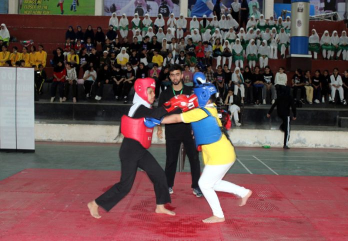 Athletes in action during District Wushu Championship. Athletes in action during District Wushu Championship.