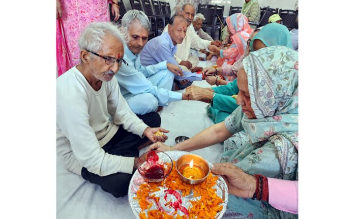 Women tying ‘Rakhis’ on the wrist of the men at Old Age Home, Amphalla in Jammu. -Excelsior/Rakesh Women tying ‘Rakhis’ on the wrist of the men at Old Age Home, Amphalla in Jammu. -Excelsior/Rakesh