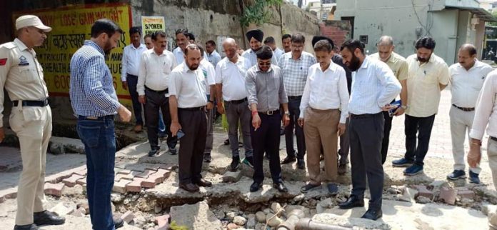 JMC Commissioner Dr Devansh Yadav along with his team of officers inspecting a damaged lane in Jammu South area. JMC Commissioner Dr Devansh Yadav along with his team of officers inspecting a damaged lane in Jammu South area.