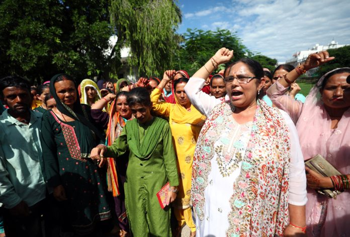 Women activists of BJP protesting in front of party office at Jammu on Tuesday. -Excelsior/Rakesh