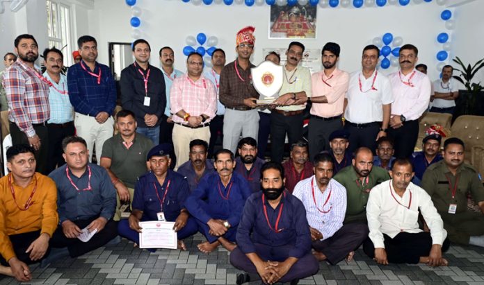 CEO of SMVD Shrine Board, Anshul Garg, along with employees during a mega feast function at Adhkuwari on Tuesday. CEO of SMVD Shrine Board, Anshul Garg, along with employees during a mega feast function at Adhkuwari on Tuesday.