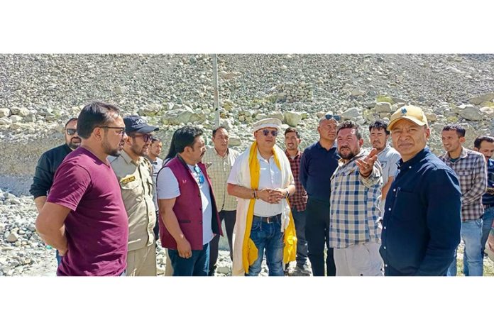 Amit Sharma interacting with the villagers during his tour to the remote areas of district Leh on Wednesday.
