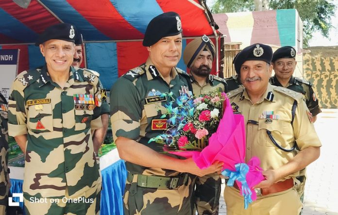 DIG JSK Range greeting DG BSF with a flower bouquet during their interaction in Jammu on Wednesday. DIG JSK Range greeting DG BSF with a flower bouquet during their interaction in Jammu on Wednesday.