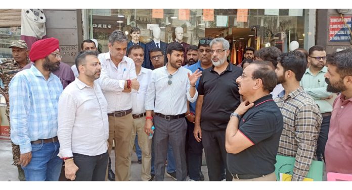 JMC Commissioner, Dr. Devansh Yadav interacts with market association members during tour of old Jammu city on Saturday. JMC Commissioner, Dr. Devansh Yadav interacts with market association members during tour of old Jammu city on Saturday.