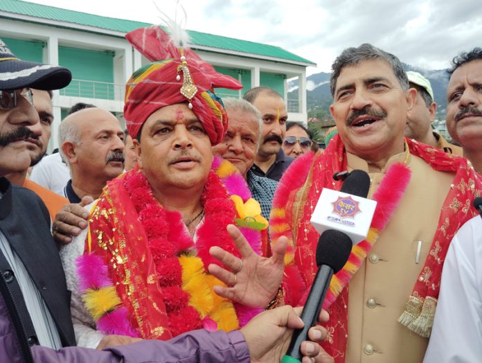 BJP candidate Daleep Parihar with party MP Jugal Kishore on way to file papers for Bhaderwah seat. — Excelsior/Tilak Raj