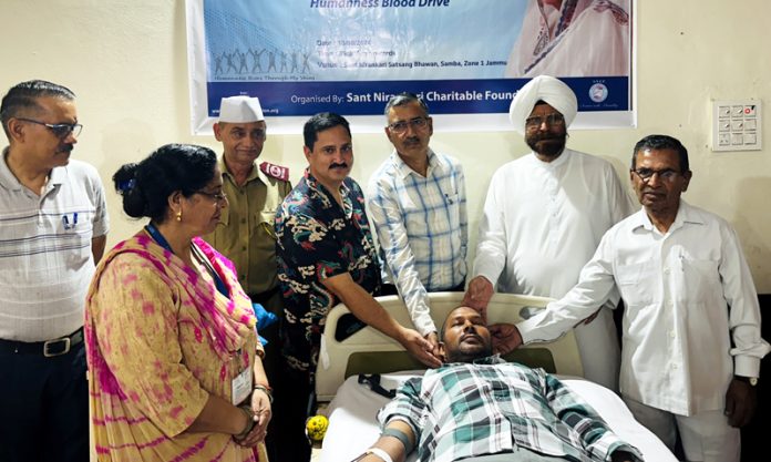 A volunteer donating blood during a camp organized by Sant Nirankari Mission in Samba on Sunday. A volunteer donating blood during a camp organized by Sant Nirankari Mission in Samba on Sunday.