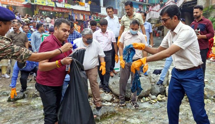 CEO of the Shrine Board and others conducting cleanliness of Banganga rivulet. CEO of the Shrine Board and others conducting cleanliness of Banganga rivulet.