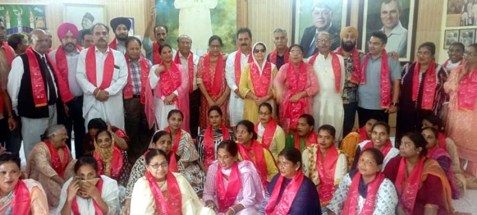 NC leaders Rattan Lal & Bimla Luthra with new entrants during function in Jammu.