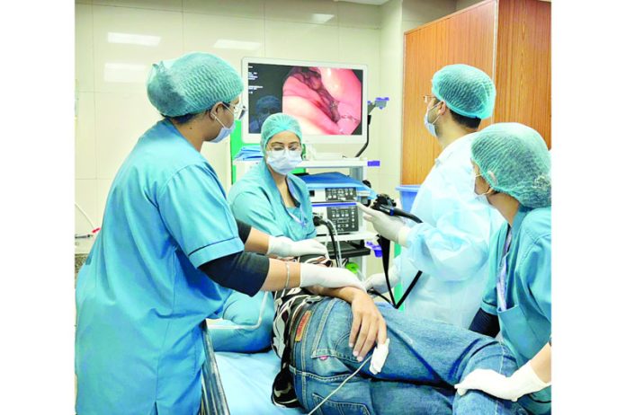 A team of doctors and technicians performing Upper GI Endoscopy on a patient at Endoscopic Procedure Unit in AIIMS Jammu.