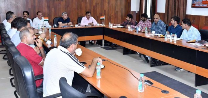 DEO Reasi Vishesh Mahajan interacting with representatives of political parties on Friday.