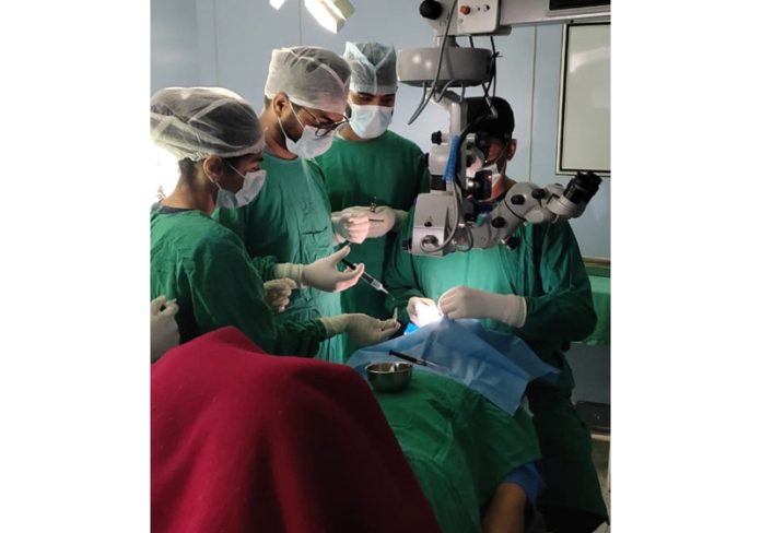 Doctors performing a corneal transplant procedure on a patient in GMC Jammu.
