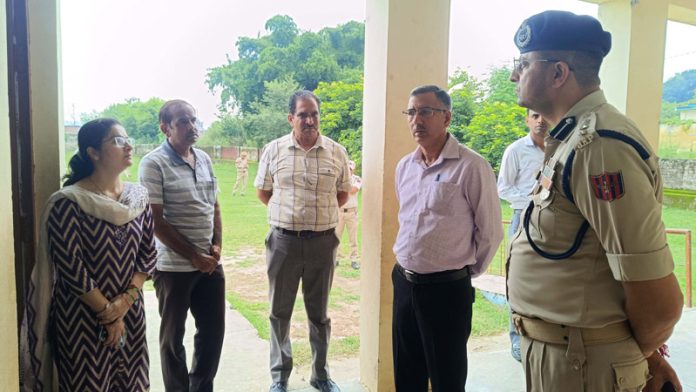 DEO and SSP Samba inspecting polling station. DEO and SSP Samba inspecting polling station.