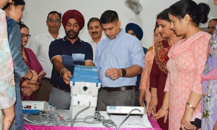 DEO, Vikas Kundal and his staff imparting training to female employees for Pink Booths in Poonch.