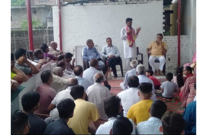BJP leader Arun Sharma addressing a public meeting at Vijaypur on Sunday.