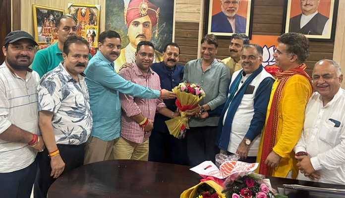 BJP leader from Katra Rohit Dubey and party candidate, Baldev Raj Sharma posing with senior party leaders at Jammu on Wednesday.