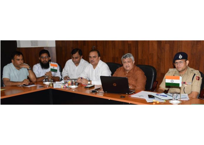 DM Vishesh Mahajan chairing a meeting on Friday.