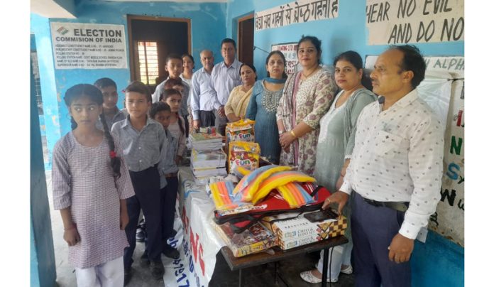 UNNAT team members presenting sports material to students.