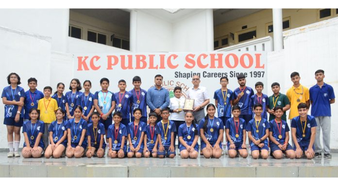 KCPS Netball athletes posing along with medals. KCPS Netball athletes posing along with medals.