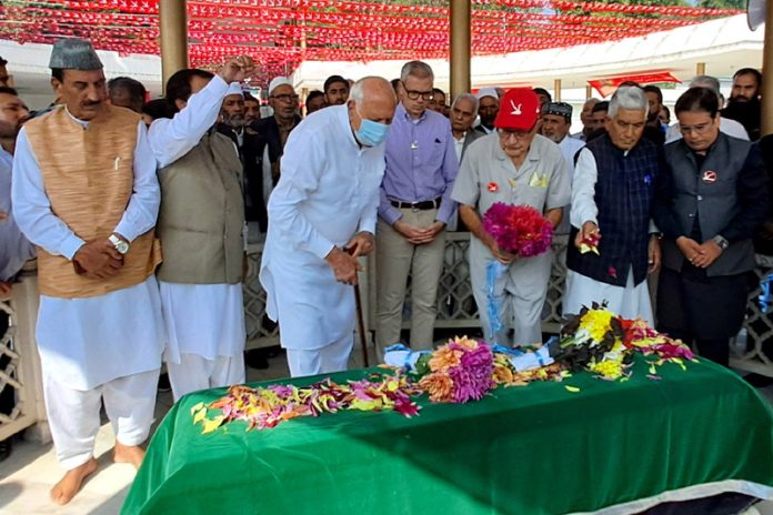 NC President Dr Farooq Abdullah along with Omar Abdullah, Mustafa Kamal and other party leaders offering floral tribute to Sheikh Mohd Abdullah on Sunday. -Excelsior/Shakeel NC President Dr Farooq Abdullah along with Omar Abdullah, Mustafa Kamal and other party leaders offering floral tribute to Sheikh Mohd Abdullah on Sunday. -Excelsior/Shakeel