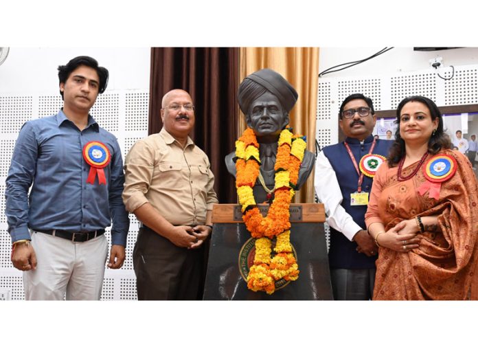 Chief guest Sandeep Gupta and other dignitaries posing together after garlanding the bust of Sir M Visvesvaraya. -Excelsior/Rakesh