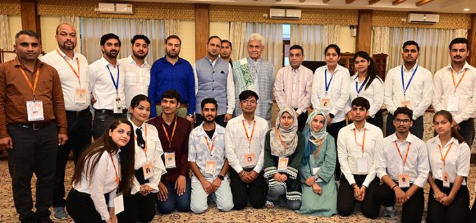 Lt Governor Manoj Sinha with the students visiting J&K under Kashmir Samvad Yatra initiative.