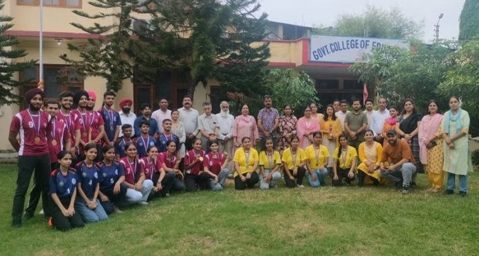 Players of the winner and runner-up teams along with others posing for a group photograph on conclusion of a Chess Tournament in Govt College of Education, Jammu.