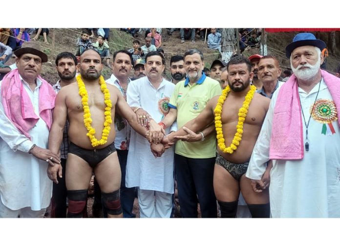 Wrestlers being introduced before main bout at Reasi by dignitaries.