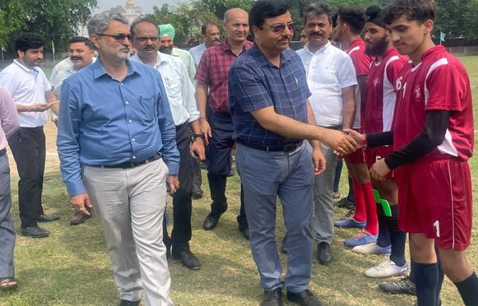 Dignitary interacting with footballers in Jammu. Dignitary interacting with footballers in Jammu.