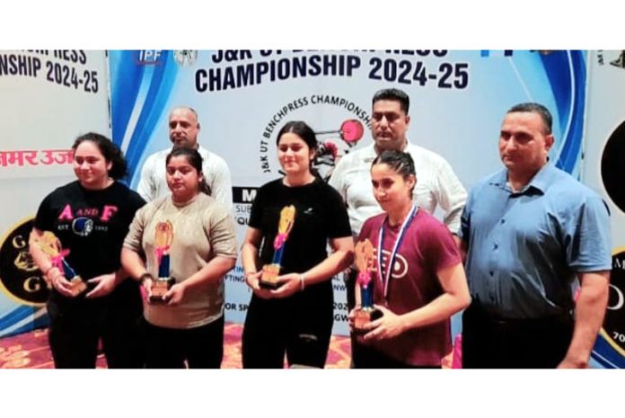 Powerlifters posing with trophies during J&K UT Bench Press Championship at Jammu. Powerlifters posing with trophies during J&K UT Bench Press Championship at Jammu.