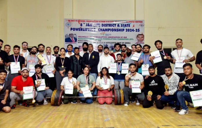 Winners in various categories of Powerlifting Championship posing with medals and certificates. Winners in various categories of Powerlifting Championship posing with medals and certificates.