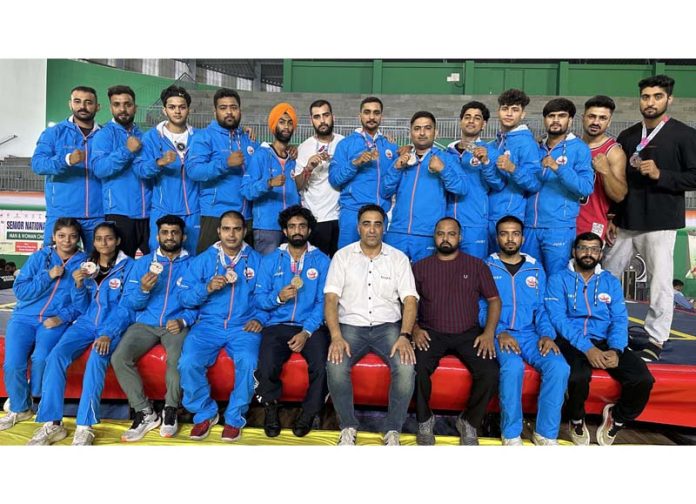J&K Wushu team posing with medals. J&K Wushu team posing with medals.