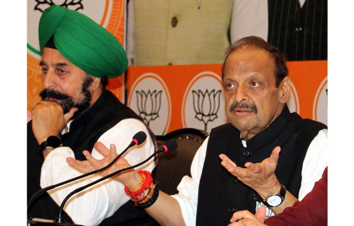 Senior BJP leaders, Devender Singh Rana and R P Singh at a press conference at Jammu on Tuesday.