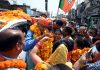 BJP candidate, Sham Lal Sharma being warmly welcomed by his supporters during a road show in Jammu North on Saturday.