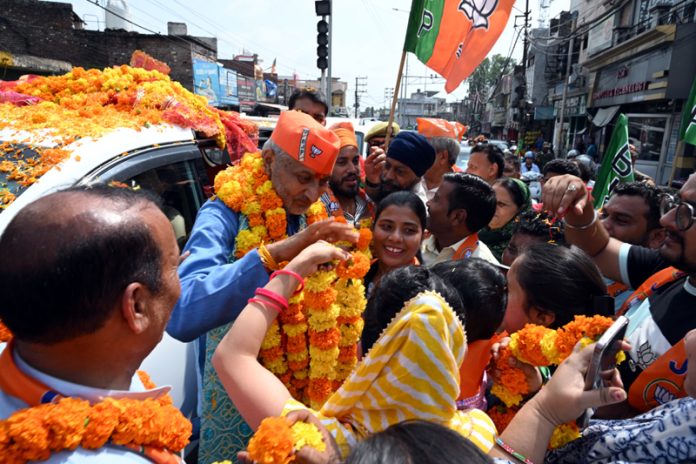 BJP candidate, Sham Lal Sharma being warmly welcomed by his supporters during a road show in Jammu North on Saturday. BJP candidate, Sham Lal Sharma being warmly welcomed by his supporters during a road show in Jammu North on Saturday.