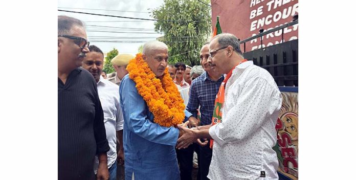 Senior BJP leader Sham Lal Sharma interacting with people in Jammu on Friday. Senior BJP leader Sham Lal Sharma interacting with people in Jammu on Friday.