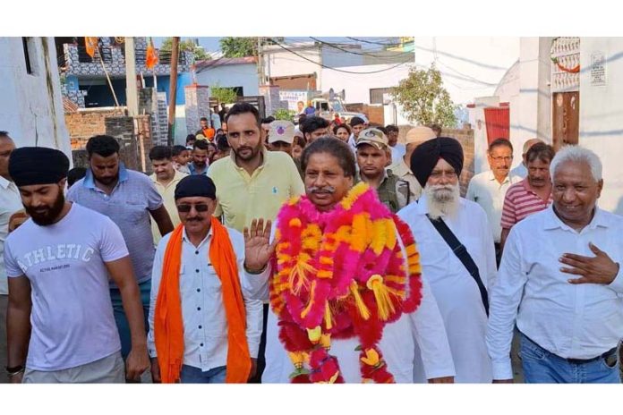 Cong candidate Raman Bhalla during poll campaign in Jammu South. Cong candidate Raman Bhalla during poll campaign in Jammu South.