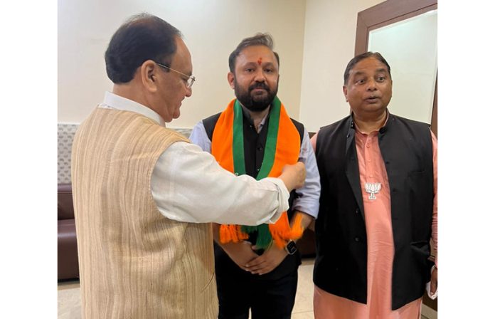 BJP National President JP Nadda welcoming Ankur Sharma into the party fold in Jammu on Sunday. BJP National President JP Nadda welcoming Ankur Sharma into the party fold in Jammu on Sunday.