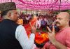 BJP leaders Ghulam Ali Khatana and Yudhvir Sethi during a party rally in Jammu East constituency on Tuesday.