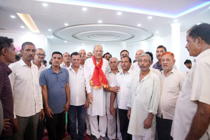 Cong candidate Mula Ram during poll campaign in Marh on Wednesday. Cong candidate Mula Ram during poll campaign in Marh on Wednesday.