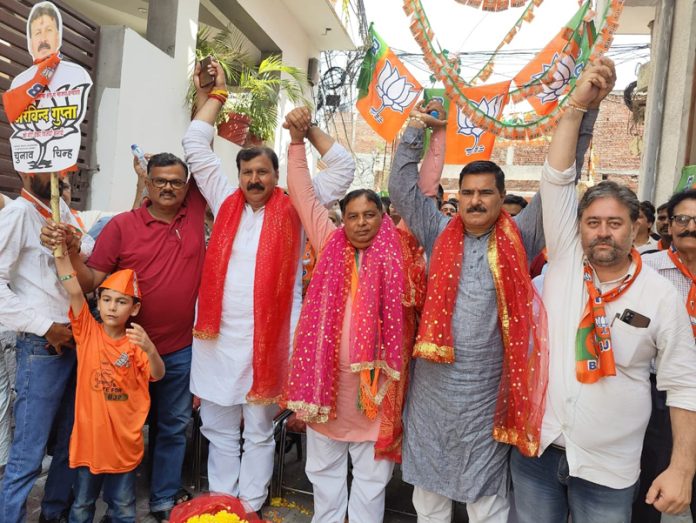 Senior BJP leader Sat Sharma along with others attending a function in Jammu on Sunday. Senior BJP leader Sat Sharma along with others attending a function in Jammu on Sunday.