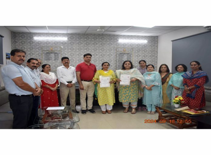 Principals of GDC Kathua and LBS College of Education display copies of MoU signed between the two institutes. Principals of GDC Kathua and LBS College of Education display copies of MoU signed between the two institutes.