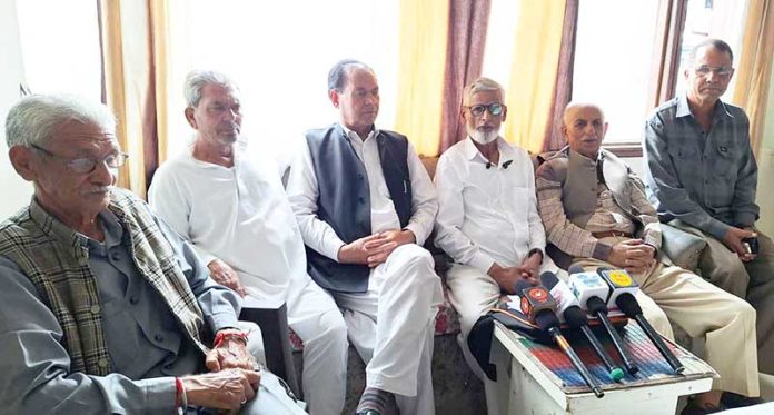 SCWC leaders addressing a press conference in Bhaderwah on Monday.