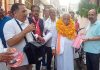 NC leader and alliance candidate, Ajay Sadhotra during door-to-door campaign in Jammu North on Monday.