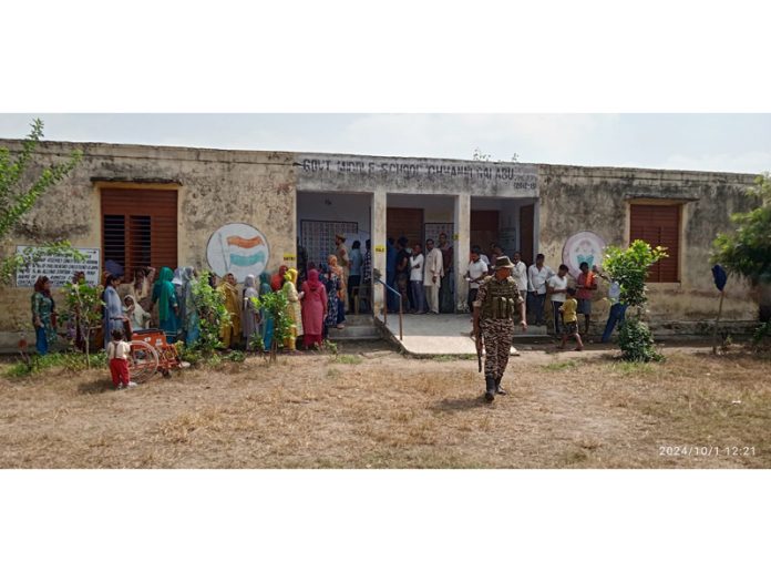 Long queues at a Polling Station in border village N S Pura of Akhnoor constituency on Tuesday.
