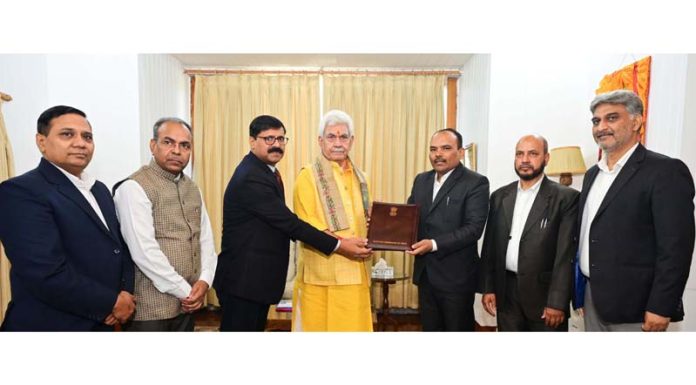 CEO P K Pole along with others submitting a copy of notification to LG Manoj Sinha in Raj Bhawan on Thursday. CEO P K Pole along with others submitting a copy of notification to LG Manoj Sinha in Raj Bhawan on Thursday.
